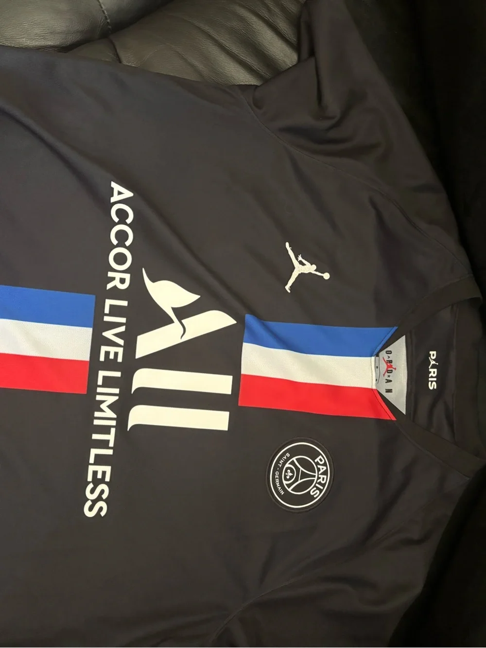 Jordan Men’s Black PSG Football Jersey with Red, White & Blue Stripes